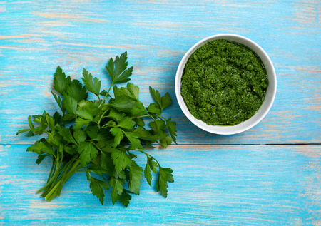 Parsley pesto in a white bowlの写真素材