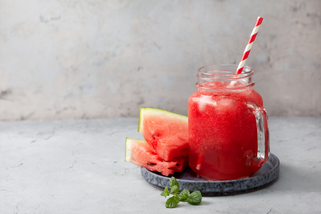 Smoothies watermelon in mason jar on gray concreteの写真素材