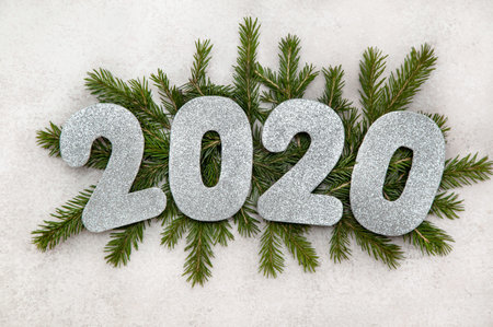 Christmas composition with numbers on the branches of a Christmas tree. view from above