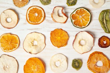fruit chips on a light wooden background. view from aboveの写真素材