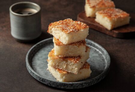 Salvadorena quesadilla on a blue plate with a cup of coffee on  brownの写真素材