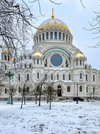 A stunning and picturesque snowy landscape showcasing a magnificent cathedral embellished with...