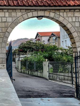 serene neighborhood with scenic background, peaceful residential street under evening sunlight