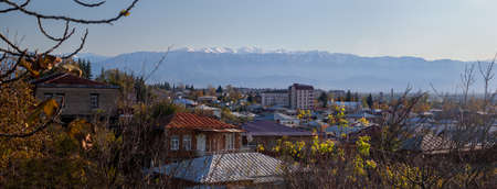 Kutaisi city overview panorama with the Caucasus mountains in the background.の写真素材