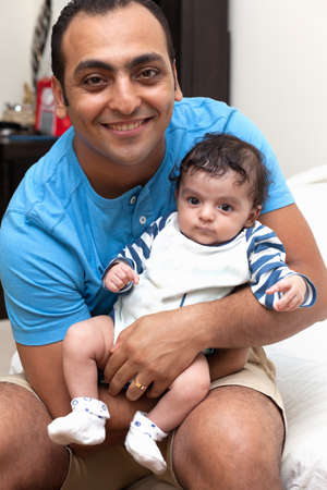 The young father holds in the arms of the little son of a baby. High quality photoの写真素材