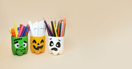 The art of handmade recycling from plastic bottle. Halloween craft ideas of container for pencils. Crafts for the childrens roomの写真素材