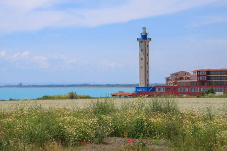 Beautiful seaside landscape with a lighthouse and buildingsの写真素材