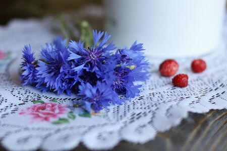 Bouquet of cornflowers on a knitted napkinの写真素材