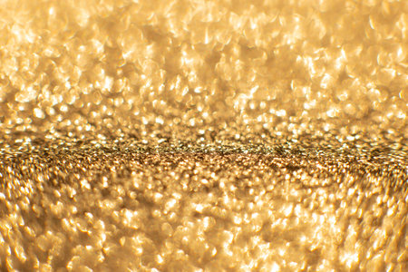 Golden sand abstract bokeh lights. defocused background