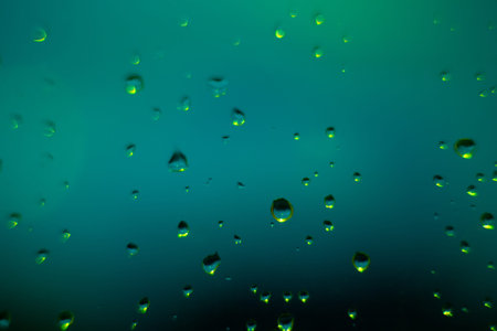 Background with drops on glass of green window.horizontal. Close upの写真素材
