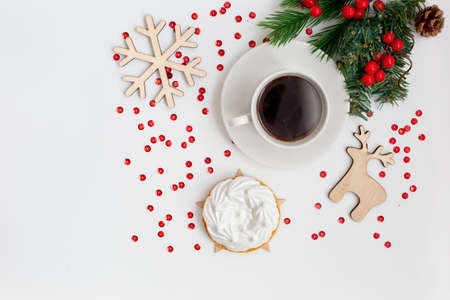 Christmas breakfast with a cup of coffee and a white meringue cake. View from above.の写真素材