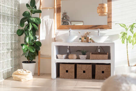 Stylish modern interior of a bright, sunny bathroomの写真素材