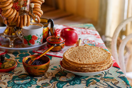 Traditional Russian food,pancakes with caviar, stand on the table with a samovarの写真素材