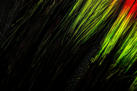 Close-up of vibrant neon green and black hair strands with abstract textureの素材