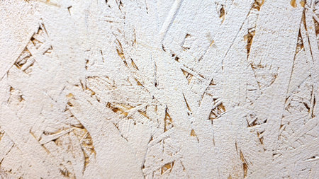 Textured close-up of white painted osb wood panel surfaceの写真素材