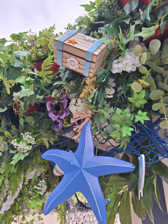 Vibrant nautical-themed decor with sea star and foliageの写真素材