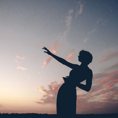 Surrealistic portrait of beautiful woman in nature, art and fashionの写真素材