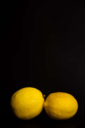 fresh lemon on black backgroundの写真素材