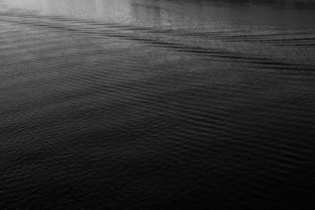 Close-up of water texture, smooth waves of water on the shore, landscape photo of waterの写真素材