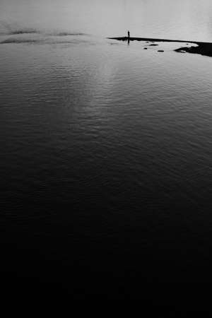 Close-up of water texture, smooth waves of water on the shore, landscape photo of waterの写真素材