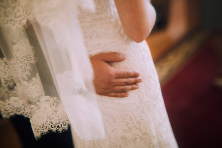 Color wedding photo, hands of husband and wife close-up, wedding ceremonyの写真素材