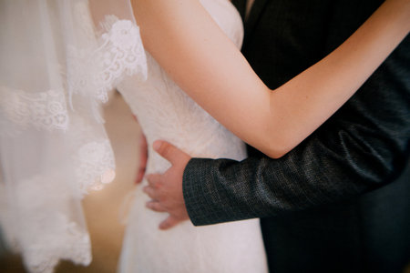 Color wedding photo, hands of husband and wife close-up, wedding ceremonyの写真素材