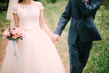 Color wedding photo, hands of husband and wife close-up, wedding ceremonyの写真素材