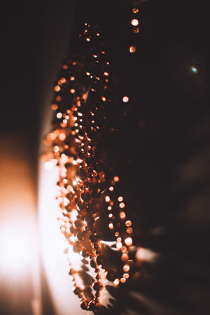 Golden abstract bokeh on black background. Holiday conceptの写真素材