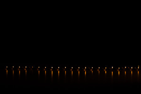 Minimalistic photography, orange beads lined up, geometry and perspective of round objects