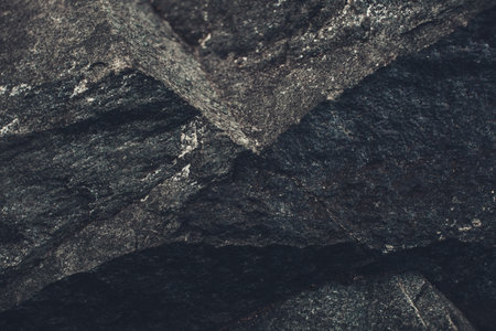 Stone dark background, texture and structure of the mountain landscape close-upの写真素材