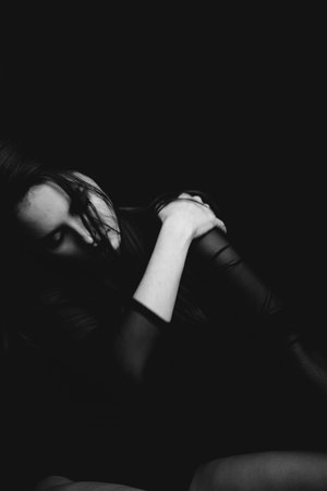 studio black-and-white portrait of a brunette girl, emotions on the face of a young woman, diverse...
