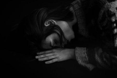emotions of sadness and frustration on the face of a young girl, black and white authentic portrait...