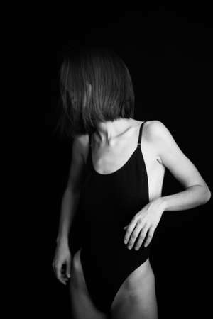 fashion monochrome portrait of sexy beautiful young woman in bodysuit. Sexy girlの写真素材
