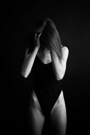 fashion monochrome portrait of sexy beautiful young woman in bodysuit. Sexy girlの写真素材