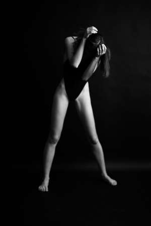 fashion monochrome portrait of sexy beautiful young woman in bodysuit. Sexy girlの写真素材