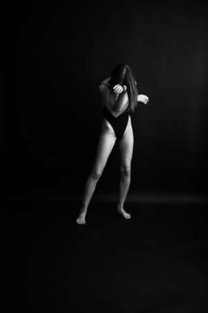 fashion monochrome portrait of sexy beautiful young woman in bodysuit. Sexy girlの写真素材
