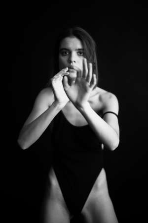 female portrait, emotions on the face of a theater actor, facial expressions and gestures close-up. black and white art photo of personの写真素材