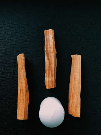 Scattered sticks of Palo Santo tree on a dark background. Top view. Organic holy tree incense from Latin America. Color photo close-up of natural frankincense.の写真素材