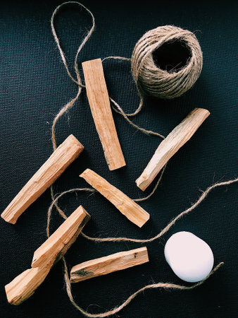 Scattered sticks of Palo Santo tree on a dark background. Top view. Organic holy tree incense from Latin America. Color photo close-up of natural frankincense.の写真素材