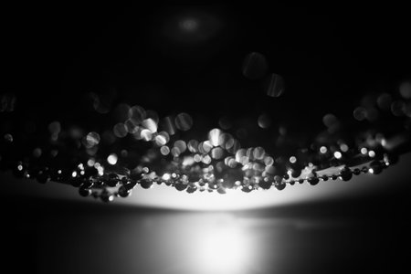 garland of silver beads close-up, beautiful abstract composition, New Year and holiday background