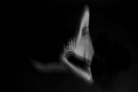 Dramatic portrait of young womanの写真素材