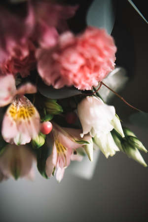 abstract soft pink floral background, bouquet of different flowers close-up, macro photography of plants. Place for text, concept for March 8 and Mother's Dayの写真素材