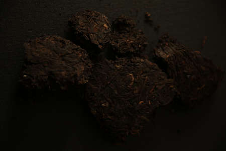 abstract tea background, black tea on dark backgroundの写真素材