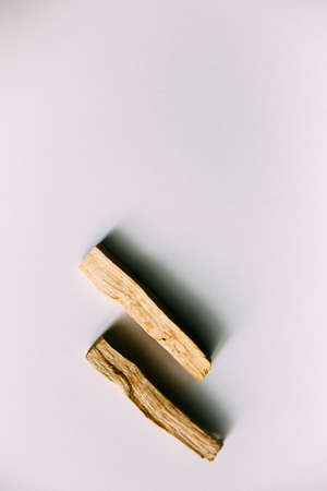 Natural incense White Sage and Palo Santo. Sacred tree of South America, color square photo.White Sage and Palo Santo on white background.の写真素材