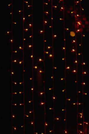 abstract background of a Christmas garland, blurred lights in the form of bokeh, space for textの写真素材