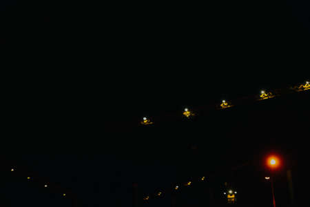 abstract background of a Christmas garland, blurred lights in the form of bokeh, space for textの写真素材