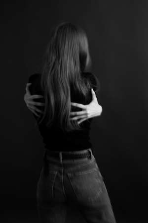 women's hands close-up, black and white photo of body details, elegant and sensual fingersの写真素材