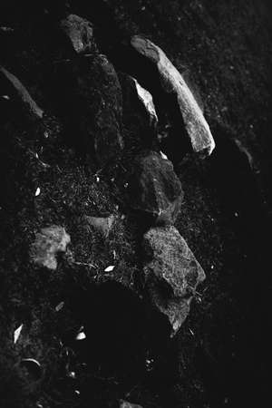 abstract rocky background, mountains and texture elements of stones close-up, black and white textureの写真素材