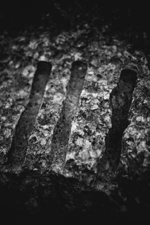 abstract rocky background, mountains and texture elements of stones close-up, black and white textureの写真素材