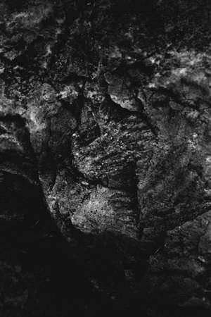 abstract rocky background, mountains and texture elements of stones close-up, black and white textureの写真素材